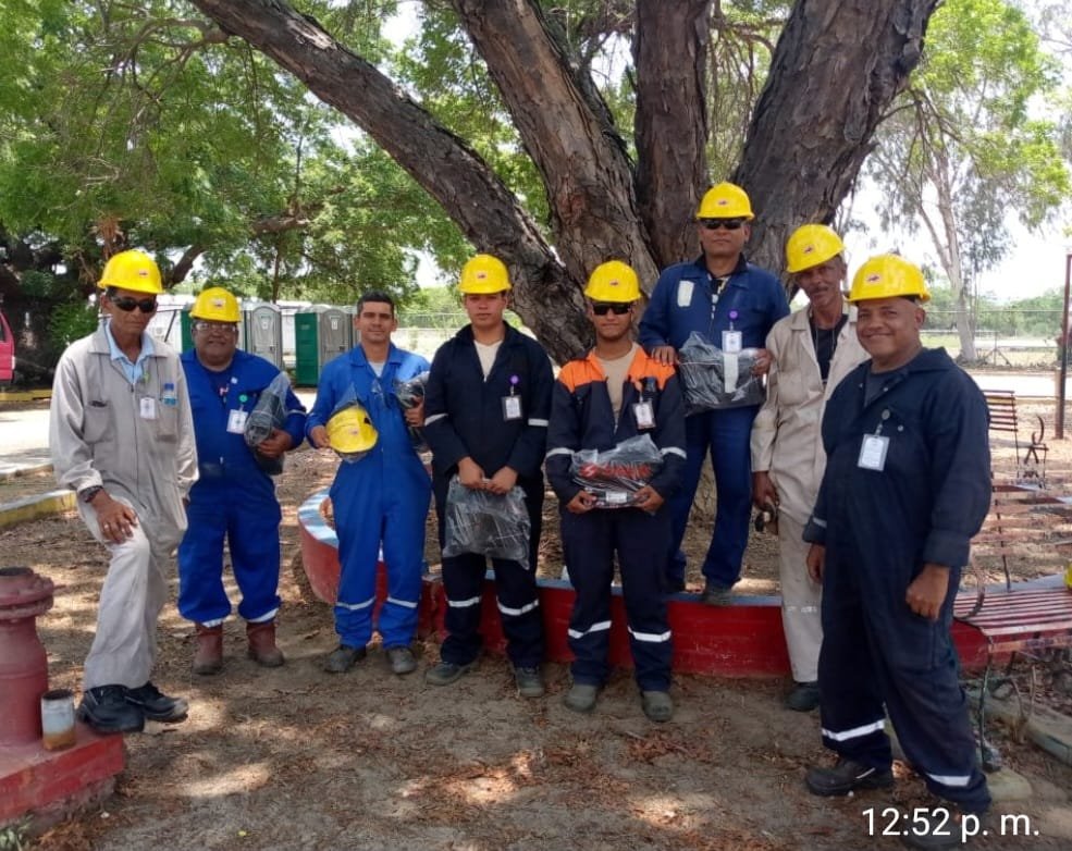 CODECA crew wearing hard hats receiving personal protective equipment