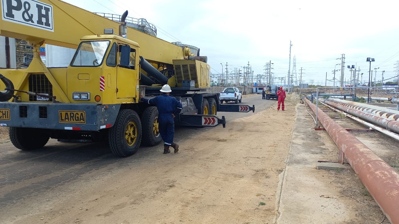 Large CODECA crane next to piping at an industrial facility